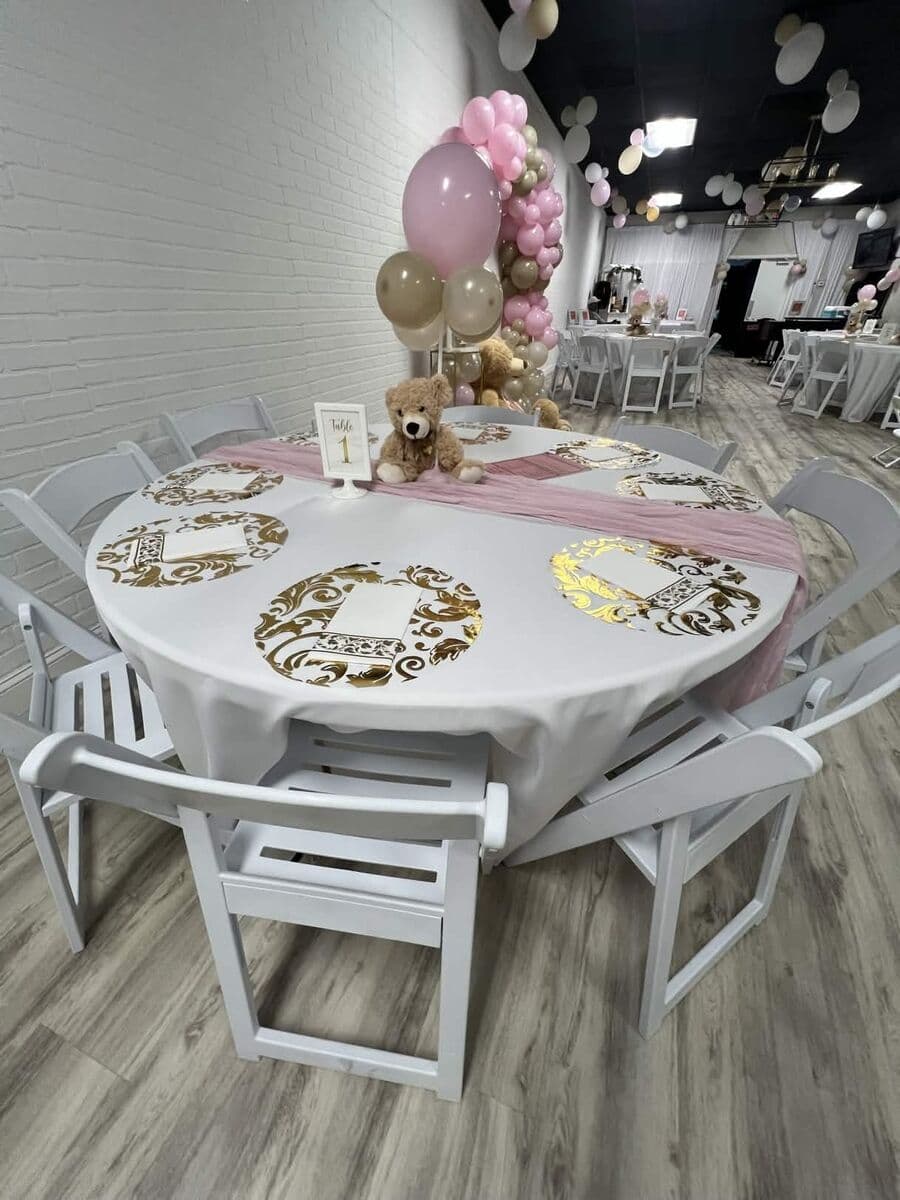 LSC Event Space baby shower setup with balloon garland and themed table settings