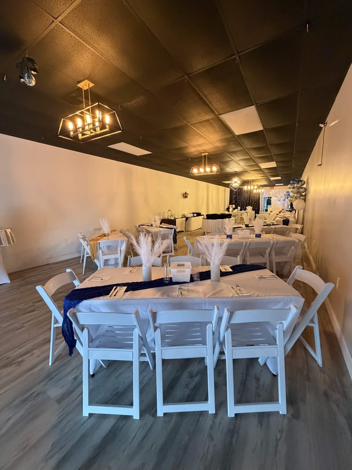 LSC Event Space — elegant navy and white table setup with pampas grass centerpieces